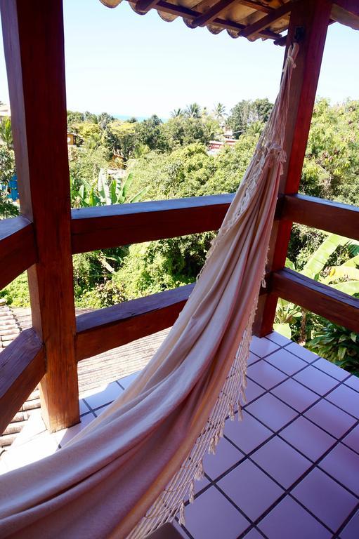 פורטו סגורו Novos Baianos Hostel E Pousada מראה חיצוני תמונה A hammock hanging from a balcony