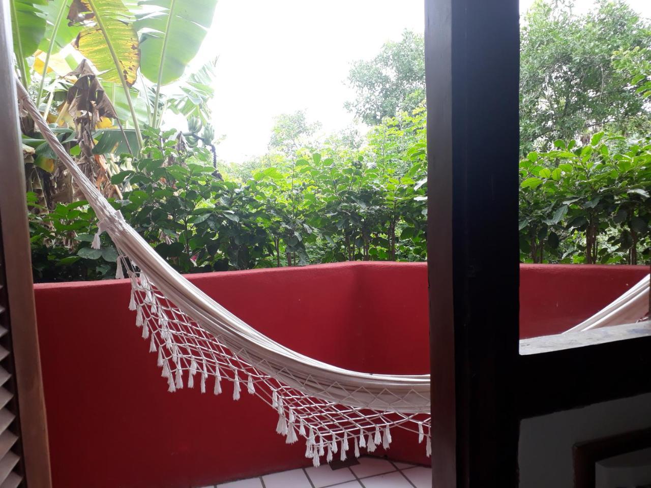 פורטו סגורו Novos Baianos Hostel E Pousada מראה חיצוני תמונה A hammock on a balcony